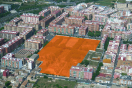 Foto aérea del ámbito. Se ve remarcada en naranja la zona que ocupa la nueva urbanización dentro del tejido urbano de Valencia.